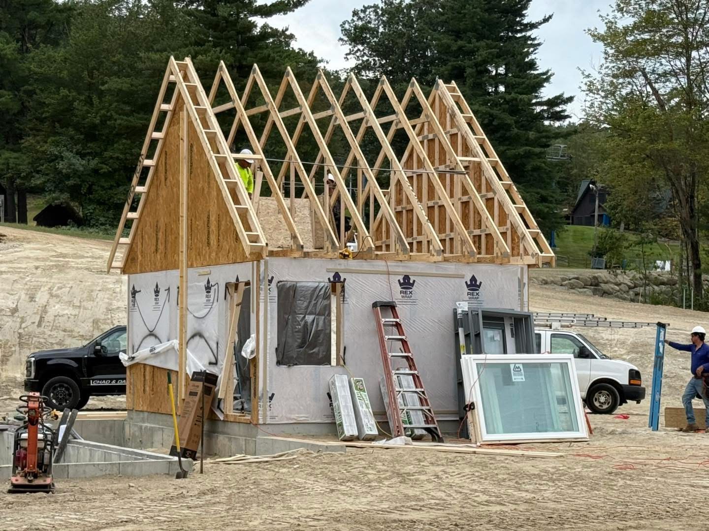 Northface Cabins under construction, timber-frame cabins along a backcountry corridor